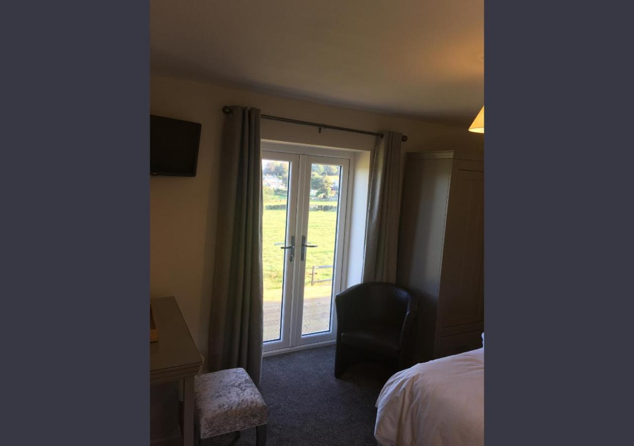 Guest room with French doors looking over fields